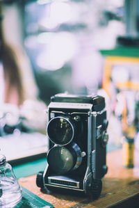 Close-up of camera on table
