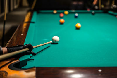 Cropped hand playing pool