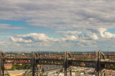 High angle view of bridge over river by buildings in city