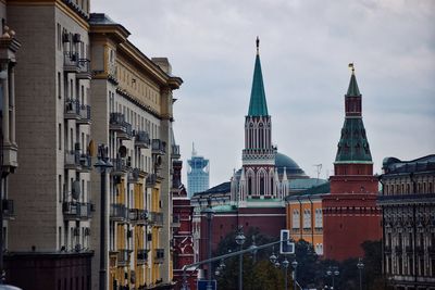 Buildings in city against sky