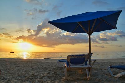 Scenic view of beach against sky during sunset