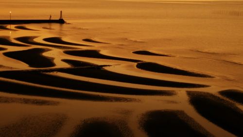 Scenic view of beach during sunset