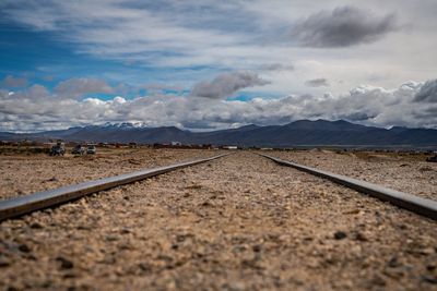 Surface level of railroad track against sky