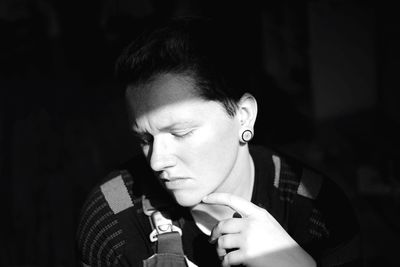 Close-up portrait of young man looking away