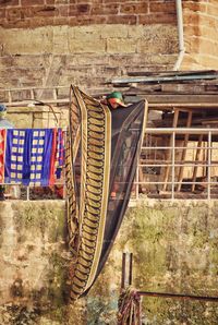 A woman drying her saree at the bank of river ganges in the holy city of varanasi, india