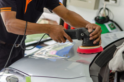 Man polishing car