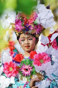 Portrait of woman with pink flowers