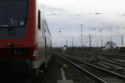 Train at railroad station against sky