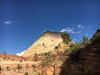 Scenic view of landscape against blue sky