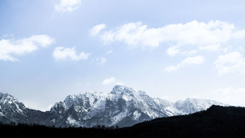 Scenic view of snowcapped mountains against sky