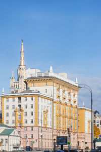 View of buildings against blue sky