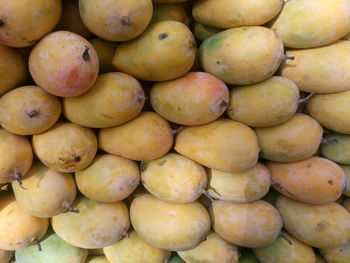 Full frame shot of mangoes for sale at market stall