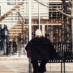 Woman standing against wall