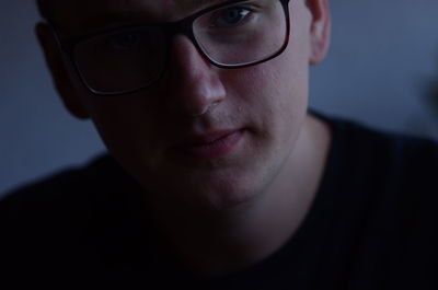 Close-up portrait of man wearing eyeglasses