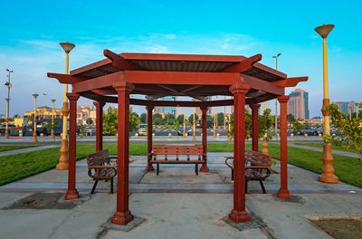 Gazebo in park against blue sky