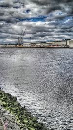 Scenic view of sea against cloudy sky