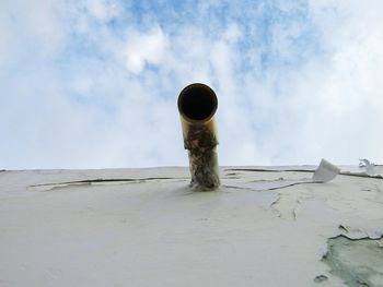 Low angle view of pipe against sky