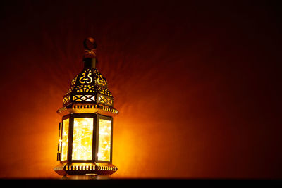 Low angle view of illuminated lamp