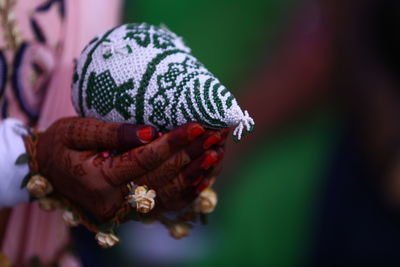 Close-up of hand holding flower