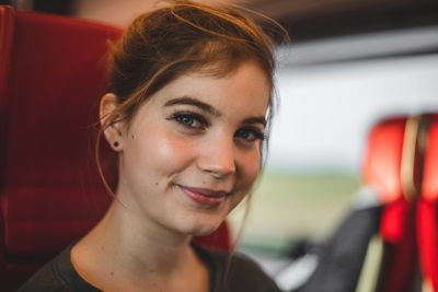 Close-up portrait of a smiling young woman