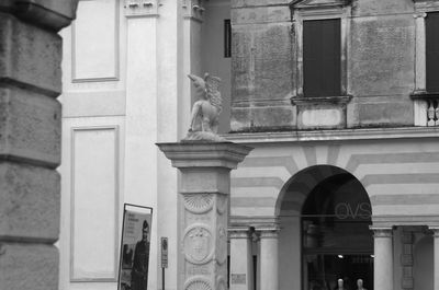 Statue against building