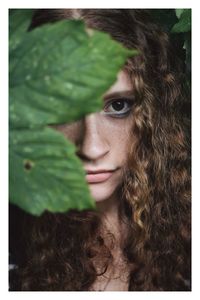 Close-up portrait of young woman with long hair