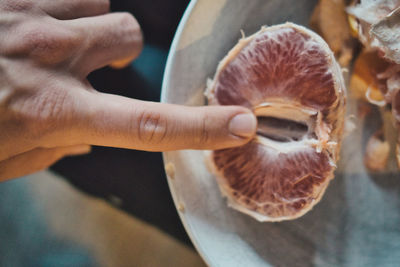 Close-up of hand holding mushroom