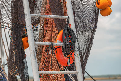 Close-up of rope, netting and life ring on shrimp boat 