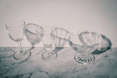 Close-up of wine glasses on table