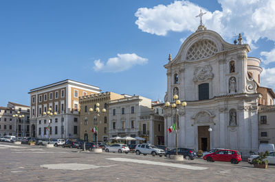 The beautiful piazza duomo in l'aquila with historic buildings and churches