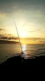 Scenic view of sea at sunset