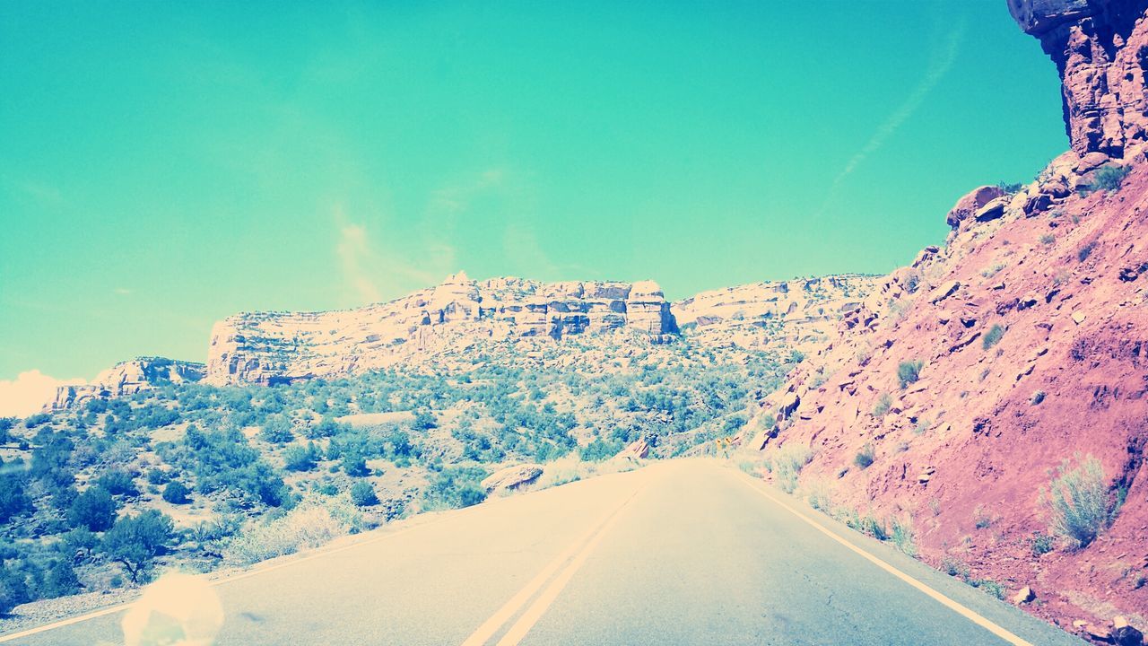 the way forward, road, transportation, blue, diminishing perspective, mountain, vanishing point, road marking, clear sky, country road, tree, sky, nature, tranquility, beauty in nature, snow, empty road, tranquil scene, scenics, landscape