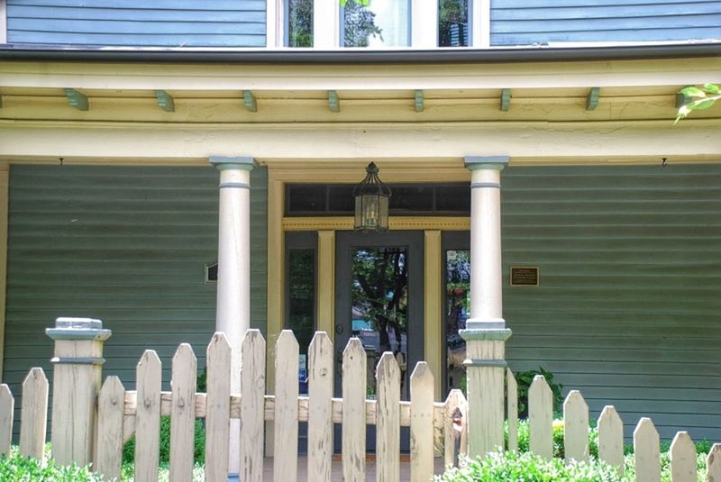 architecture, built structure, building exterior, architectural column, column, gate, window, entrance, in a row, building, day, closed, protection, door, railing, safety, outdoors, facade, no people, fence