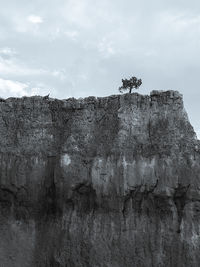 Low angle view of rock formations against sky