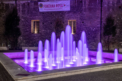 Panoramic view of illuminated building at night