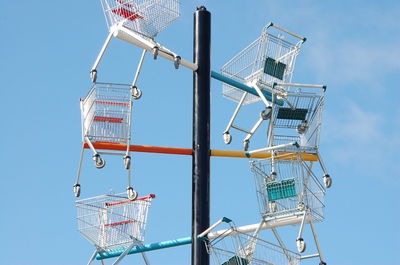 Low angle view of cranes against clear sky