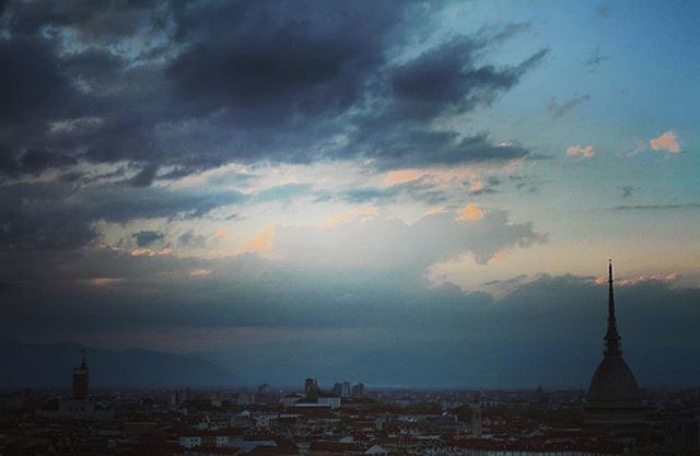 architecture, building exterior, built structure, sky, cloud - sky, city, cloudy, sunset, cityscape, dusk, weather, cloud, travel destinations, silhouette, religion, dramatic sky, outdoors, travel, place of worship, no people