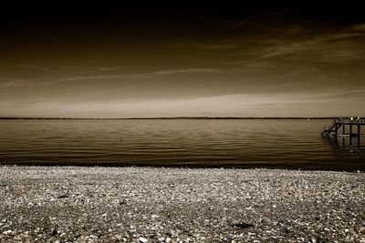 Scenic view of sea against sky at sunset