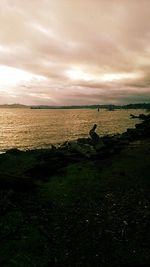 Scenic view of sea against cloudy sky