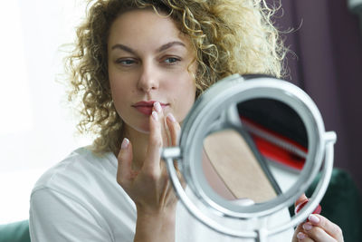 Close-up of young woman looking away