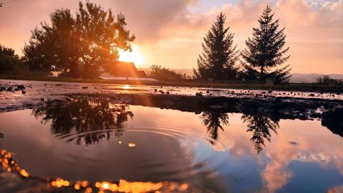 Scenic view of lake against sky during sunset