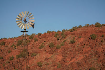 Low angle view of wind turbine against sky