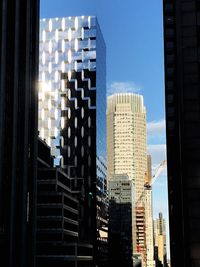 Skyscrapers in city against sky