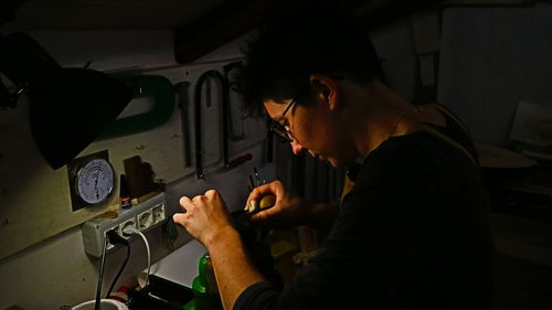 Side view of man using mobile phone