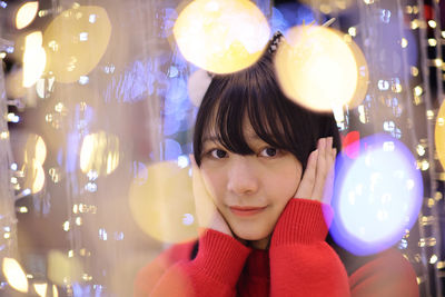 Portrait of young woman with balloons