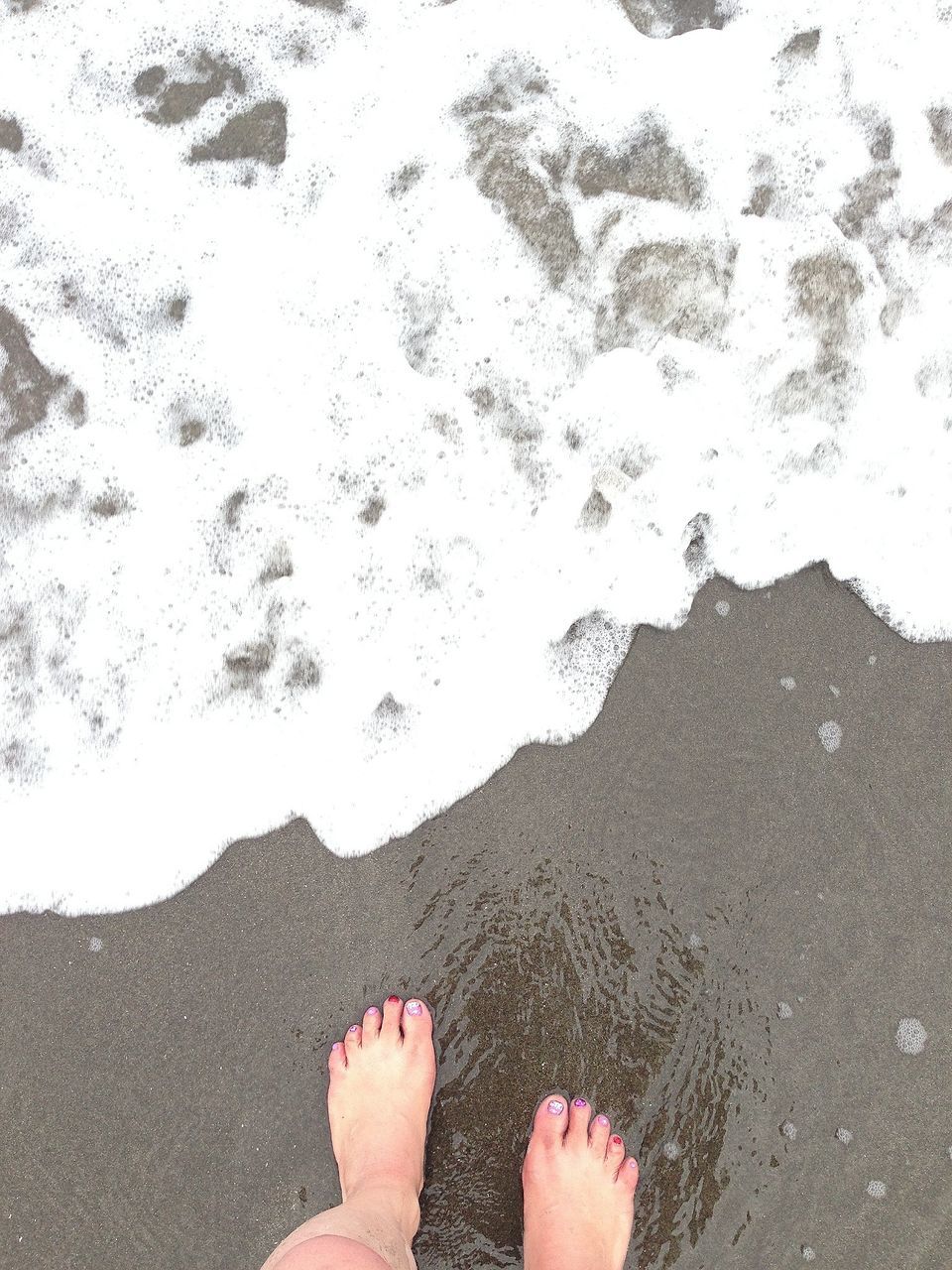 low section, personal perspective, person, human foot, barefoot, beach, water, standing, lifestyles, sand, high angle view, leisure activity, unrecognizable person, shoe, part of, shore