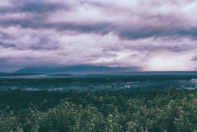 Scenic view of sea against cloudy sky