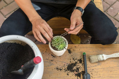 High angle view of person preparing food on table