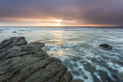 Scenic view of sea against sky during sunset