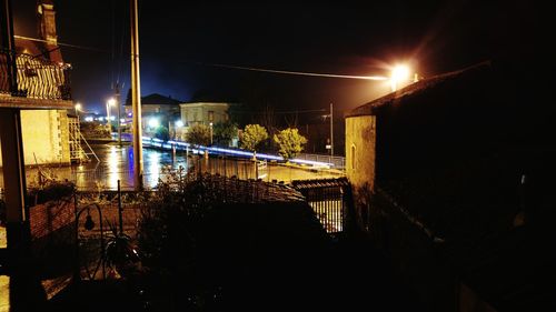 Illuminated bridge at night